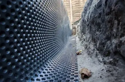 Dimpled membrane at foundation footing